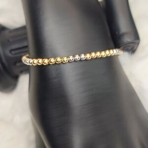 Elegant Gold and Silver Beaded Bracelet